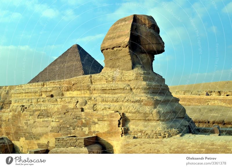 Sphinx is sitting in the desert for ages looks like camel Vacation & Travel Tourism Sand Sky Architecture Monument Stone Old Historic Egypt pyramid Cairo