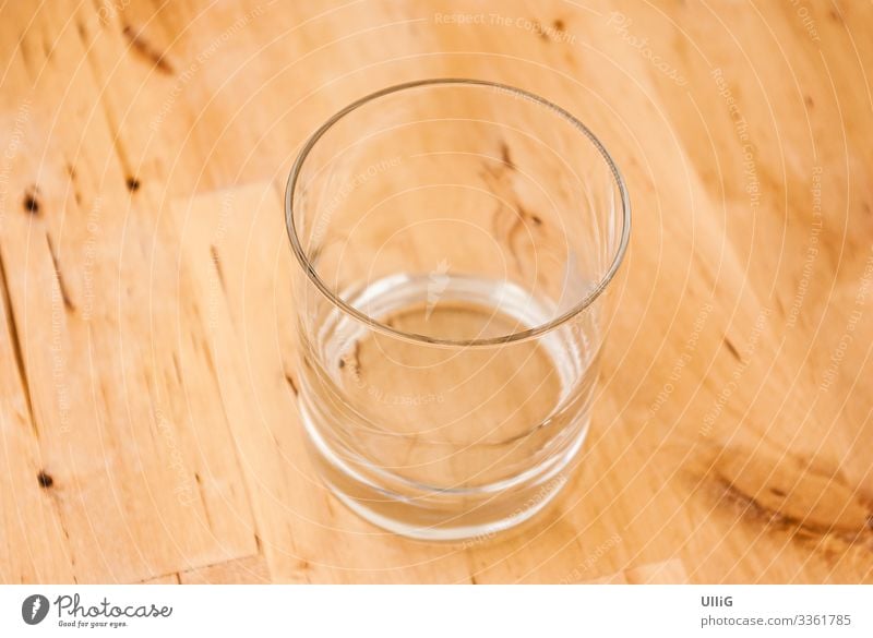 The glass is already completely empty - a single empty glass on a wooden table. Glass Empty drinking glass Tumbler Thirst Beverage Drinking Services
