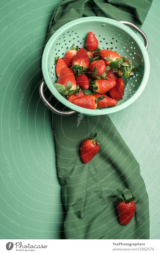 Ripe strawberries in a rustic colander. Fresh berries Fruit Dessert Candy Nutrition Organic produce Healthy Eating Sieve Delicious Natural above view