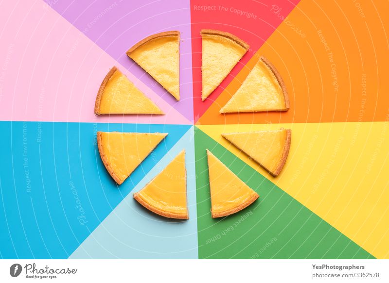 Sliced cheesecake on a rainbow background. Cake slices Food Dairy Products Dessert Candy Delicious Tradition above view bakery goods cheese cake cheese pie