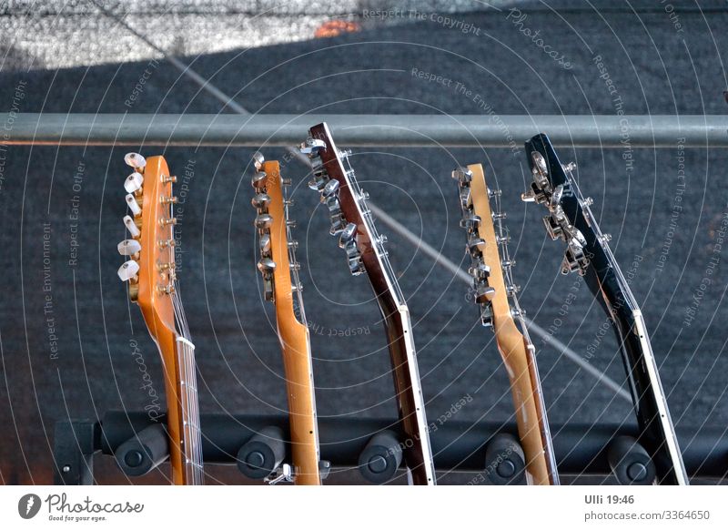 Guitars on a stage. Style Joy Summer Entertainment Event Stage Feasts & Celebrations Rock concert Downtown Marketplace Guitar stand Wood Metal Utilize To enjoy