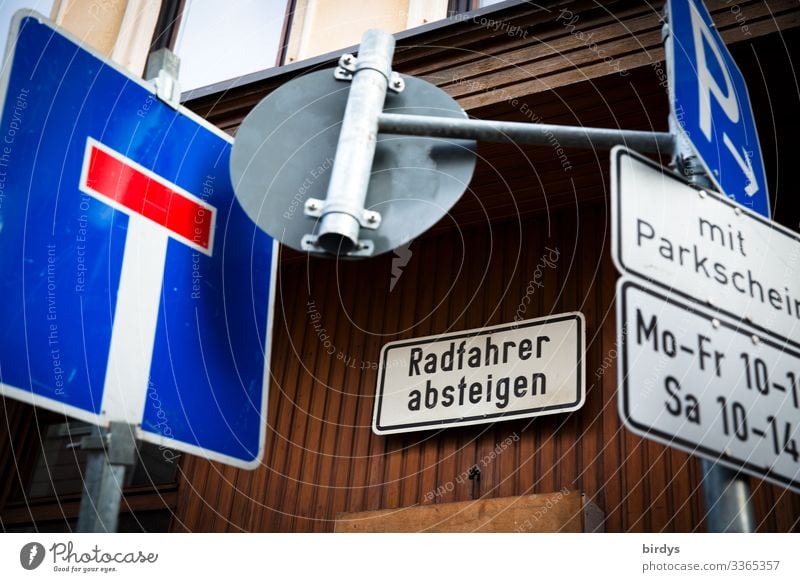 Traffic (t)turnaround Transport Traffic infrastructure Road traffic Motoring Cycling Road sign Sign Characters Signs and labeling Authentic Town Many Blue Brown