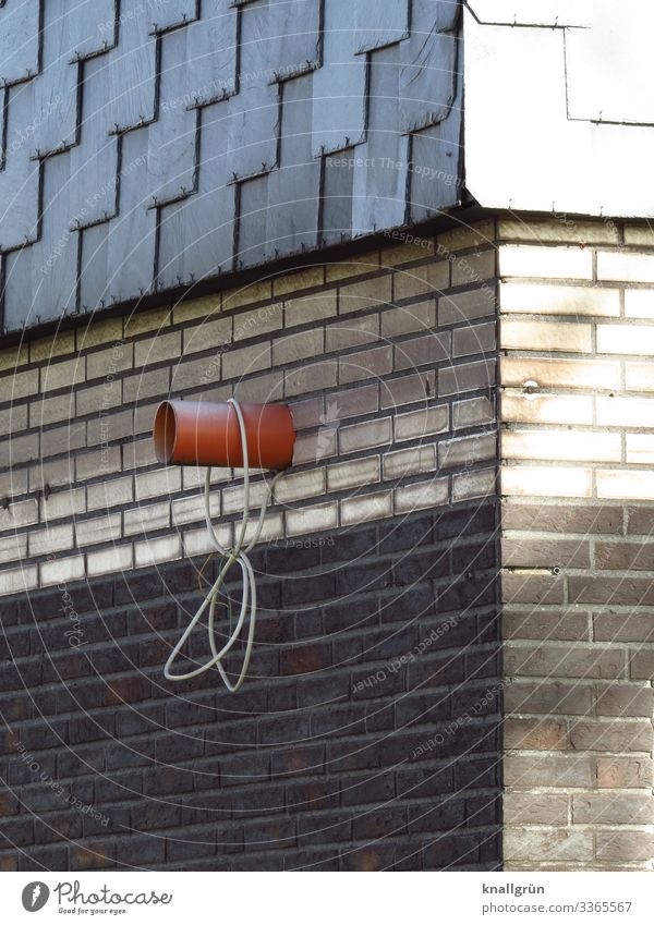 house corner House (Residential Structure) Wall (barrier) Wall (building) Brick Pipe Cable Hang Dirty Sharp-edged Town Brown Gray White Living or residing Slate