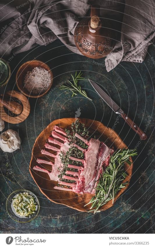Raw lamb racks with fresh rosemary Food Meat Herbs and spices Cooking oil Nutrition Organic produce Crockery Style Living or residing Restaurant
