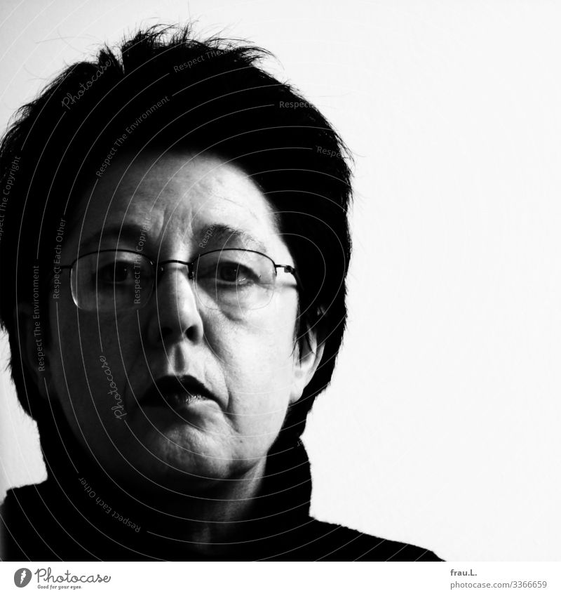 53 Human being Feminine Woman Adults 1 45 - 60 years Eyeglasses Black-haired Short-haired Observe Looking Uniqueness Skeptical Earnest Black & white photo