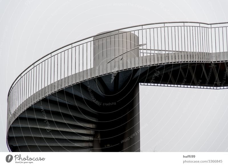 90° profile of a spiral staircase with fine-linked banister and visible undersides of the steps Clouds Bad weather Fog Town Manmade structures Architecture