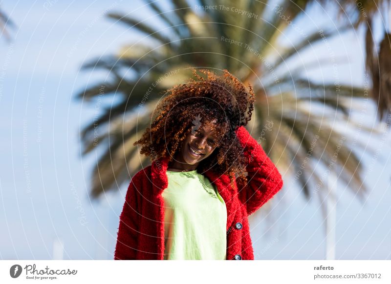 Portrait of a beautiful afro woman standing in the street Lifestyle Happy Beautiful Face Vacation & Travel Human being Feminine Young woman Youth (Young adults)