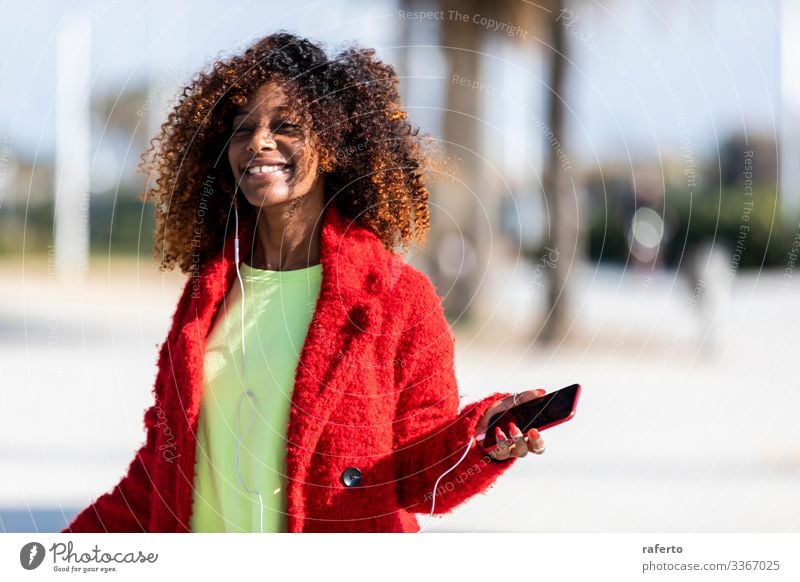 Young afro american woman laughing while dancing outdoors Lifestyle Joy Happy Beautiful Face Human being Feminine Young woman Youth (Young adults) Woman Adults