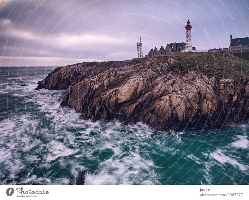 Lighthouse on Breton rocky coast with waves and sea Wide angle Exterior shot Colour photo Idyll Horizon Hope Wanderlust Homesickness Calm White Brown Blue