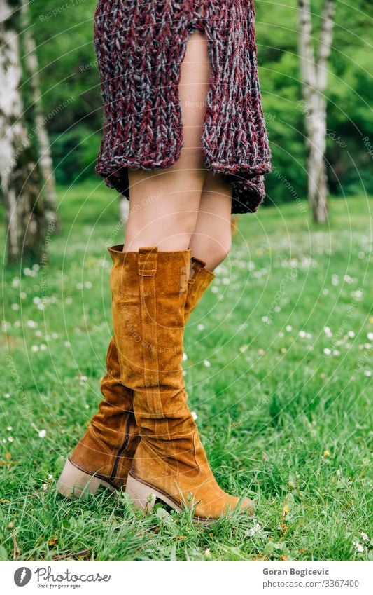 Young woman in knitted dress in the park Lifestyle Style Beautiful Summer Human being Youth (Young adults) Woman Adults Legs 1 18 - 30 years Autumn Park Fashion