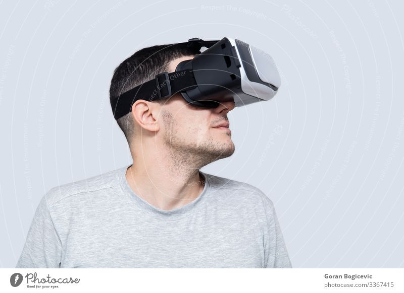 Young Man Using Vr Headset Experiencing Virtual Reality A Royalty Free Stock Photo From Photocase