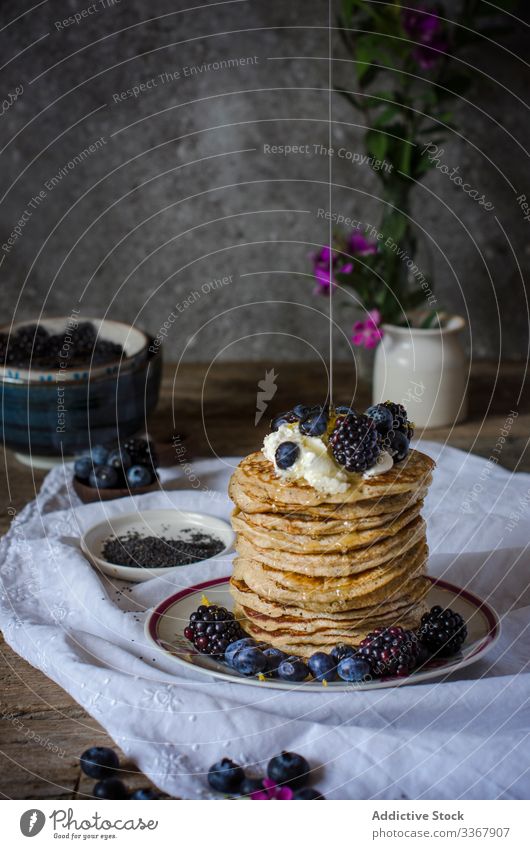 Tasty pancakes with blackberries and blueberries queso ricotta Pancakes berry sweet breakfast food raspberry stack meal morning healthy fresh plate lunch