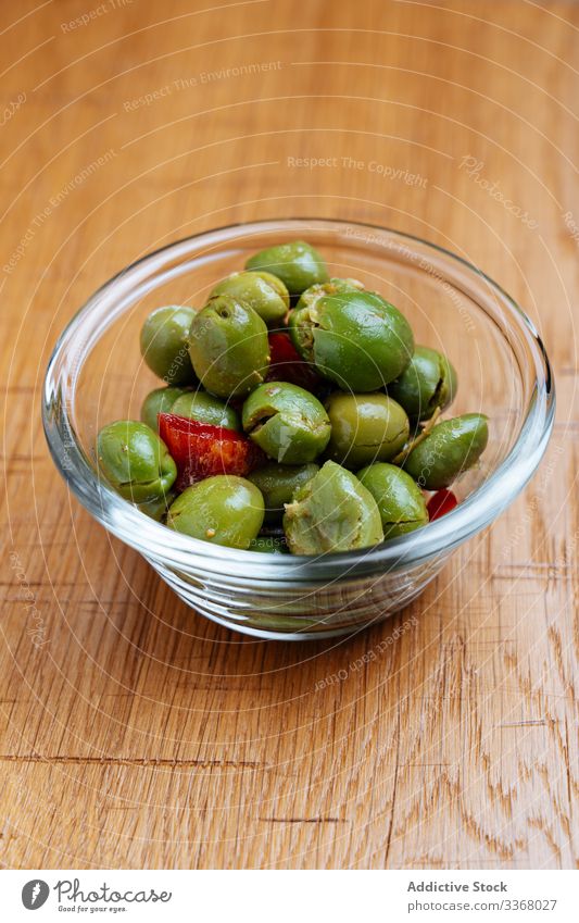 Snack of olives and tomatoes snack dish bowl glass table wooden green food cuisine appetizer meal delicious healthy plate natural organic nutrition fresh tasty