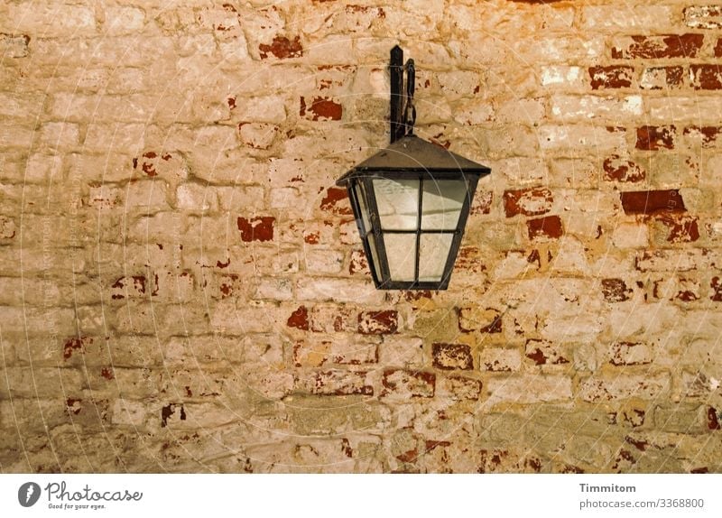 This wall has seen a lot! Wall (building) Wall (barrier) brick wall Brick wall Old vintage Colour peeled off frowzy Lamp Metal Glass Suspension masonry