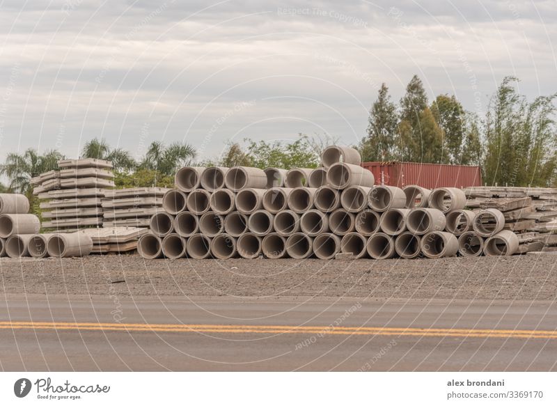 A stack of stacked concrete pipes for use in road works. architectural architecture background beam block bridge building cement city column columns