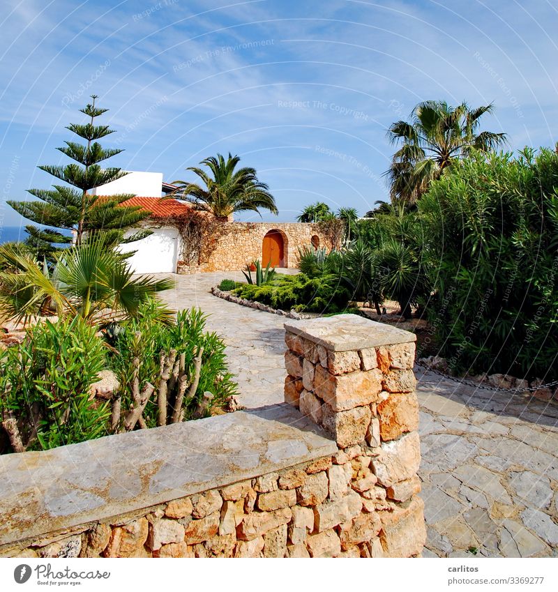 Natural stone wall in front of mediterranean villa at the sea Spain Balearic Islands Majorca Wall (barrier) Mares Villa palms Goal Archway Door locked Safety