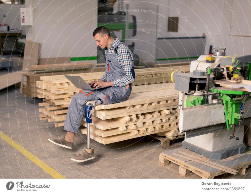 Disabled Young Man Working At Furniture Factory A Royalty Free Stock Photo From Photocase