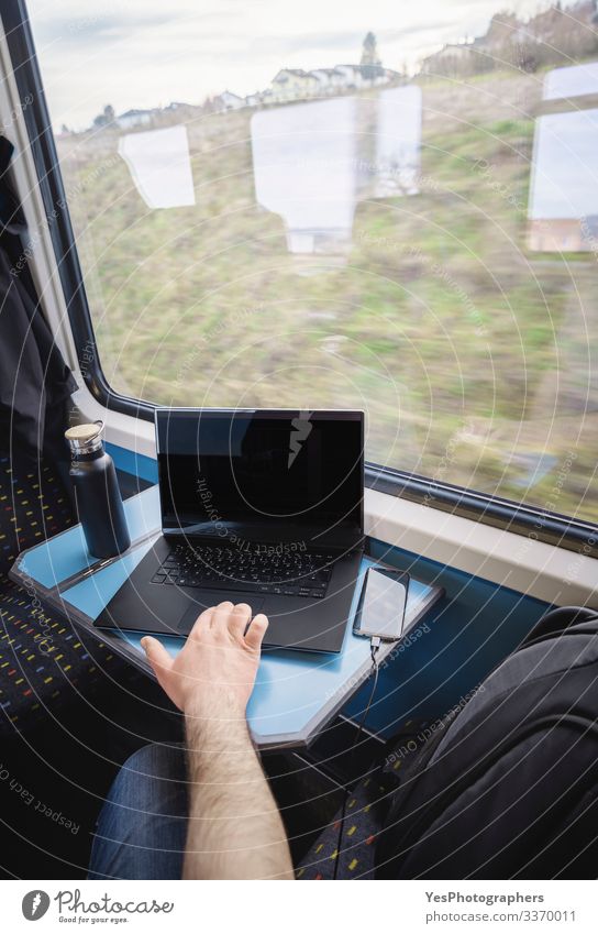 Using laptop on train travel. Train interior. Business commuting Vacation & Travel Tourism Trip Chair Table Work and employment Transport Passenger traffic