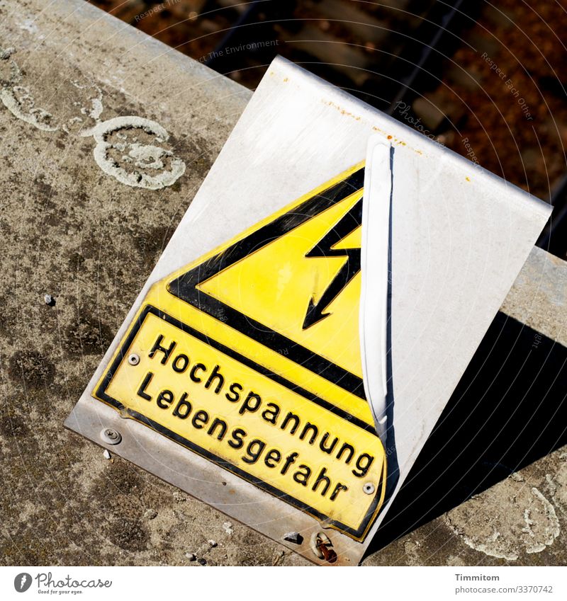 high voltage Rail transport Concrete Metal Plastic Sign Characters Signage Warning sign Line Old Broken Brown Yellow Gray Black Silver Emotions Stupid Risk