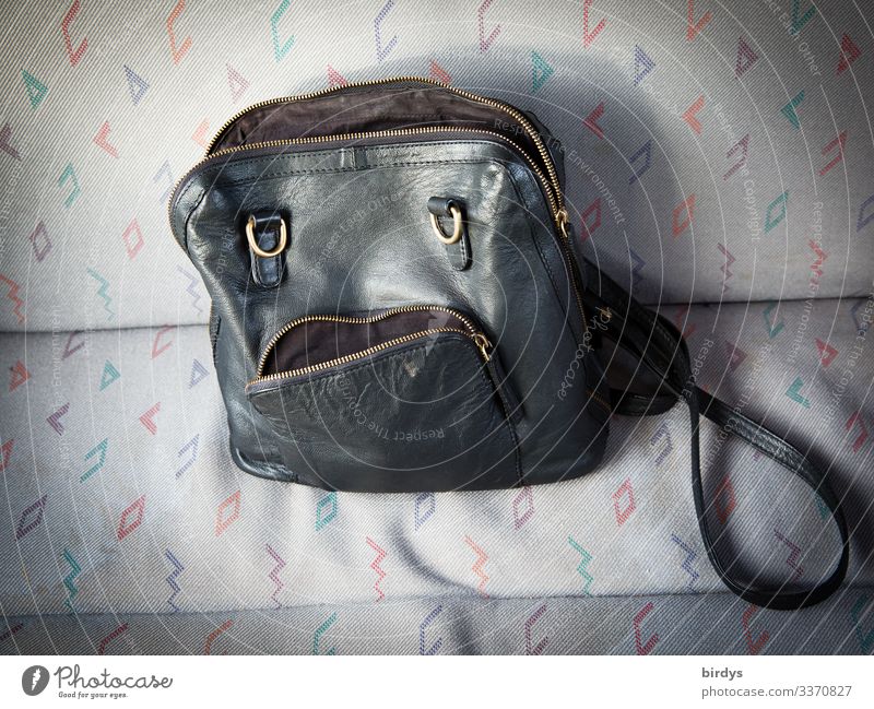 Handbag with human-looking face and grumpy expression Face Disappointment Sadness Bad mood Human likeness facial expression grumble Insulted Facial expression