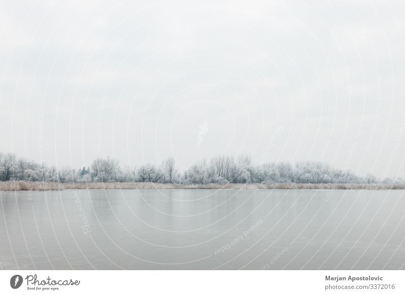 Boats in a frozen lake in winter time - a Royalty Free Stock Photo from  Photocase