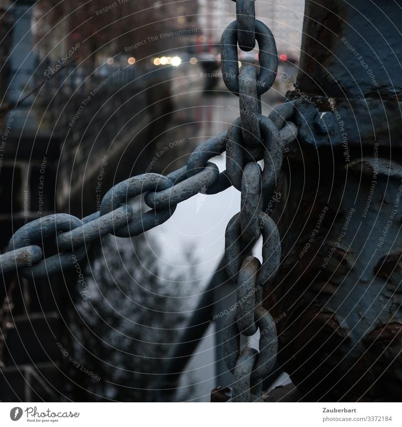 Chain links on a bridge railing over a canal Handrail Channel somber Colour photo Exterior shot Metal Detail Rust Shallow depth of field Subdued colour