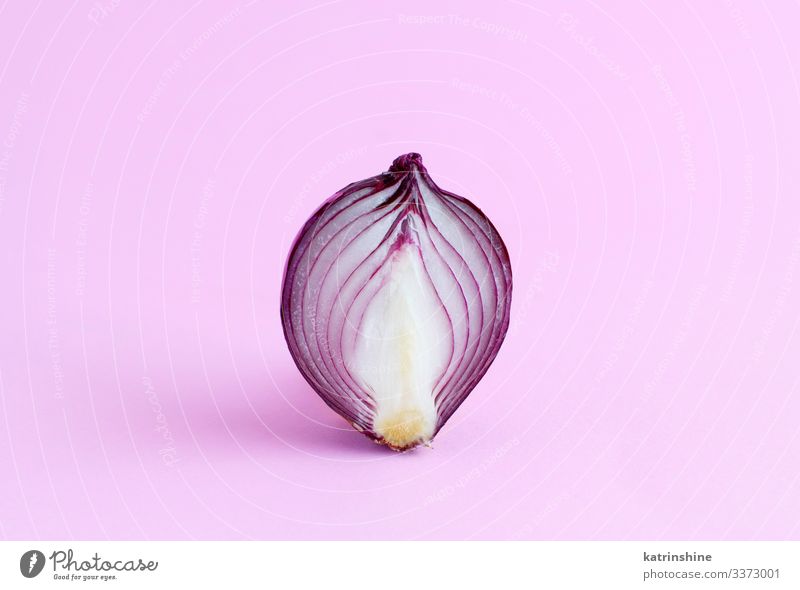 Purple onion on a light pink background Vegetable Vegetarian diet Fresh Natural Pink Red White Onion Sliced Half food healthy Monochrome Raw Organic Ingredients