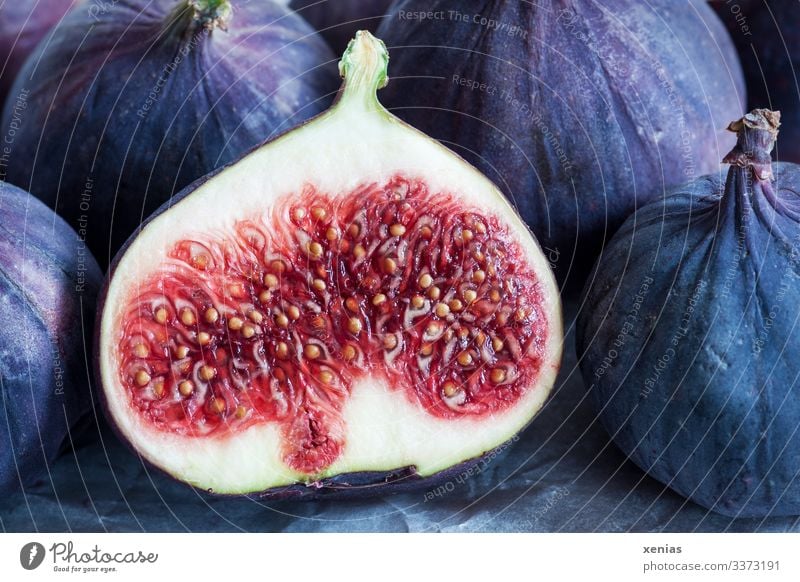 sliced juicy fig before other figs Fig Food fruit Nutrition Organic produce Vegetarian diet Diet Italian Food Fresh Healthy Glittering Delicious Juicy Sweet