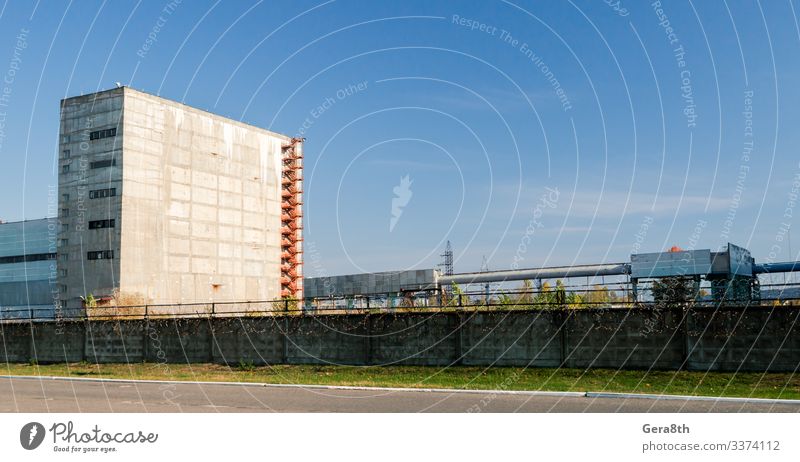 high nuclear waste storage building in Chernobyl Vacation & Travel Tourism Trip Plant Sky Clouds Autumn Grass Building Street Threat Blue Disaster
