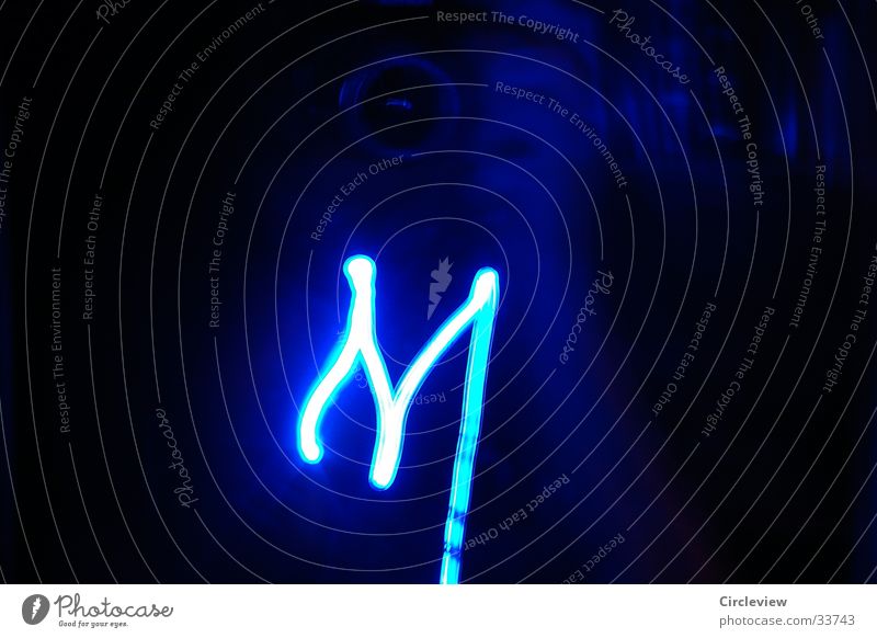 "M" from light Letters (alphabet) Light Black Characters Long exposure Blue letter