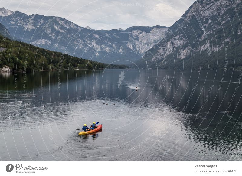 People rowing in Bohinj lake, Alps mountains, Slovenia. Lifestyle Beautiful Leisure and hobbies Vacation & Travel Tourism Adventure Mountain Sports Human being