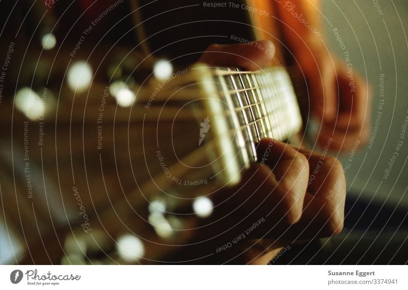 Close-up of guitar playing Hand Fingers Playing Art Music Make music Guitar Guitarist Guitar neck Guitar string Artist Compose Composer Leisure and hobbies