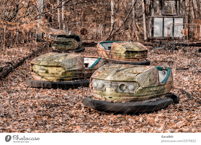 cars in an abandoned amusement park in Chernobyl Vacation & Travel Tourism Trip Nature Plant Autumn Tree Leaf Park Transport Car Rust Old Threat Retro Dangerous