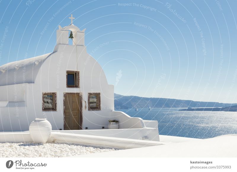 Traditional white orthodox church in Oia, Santorini, Greece. Beautiful Tourism Sun Ocean Island Sky Tree Volcano Village Town Church Architecture Concrete Wood