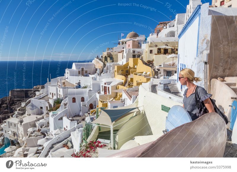 Oia village at sunset, Santorini island, Greece. Beautiful Vacation & Travel Tourism Summer Ocean Island House (Residential Structure) Woman Adults Culture
