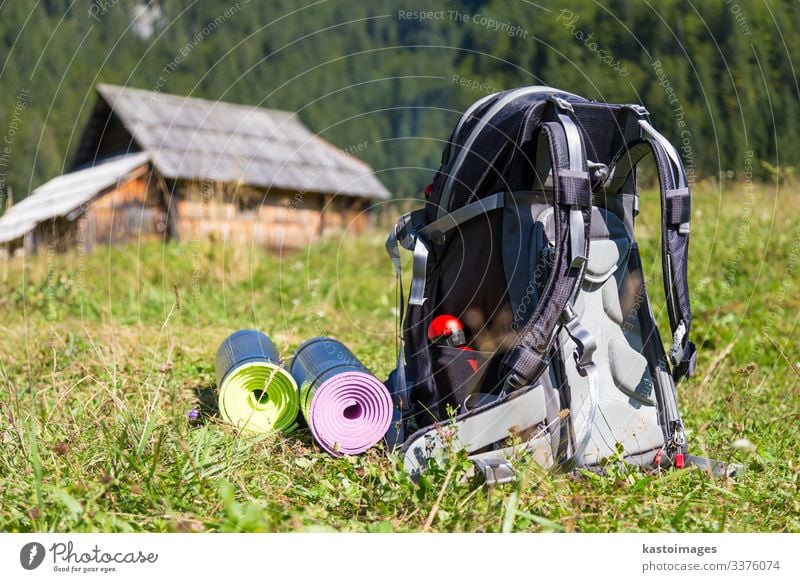 Women stay with Backpack with reusable water bottle in a pocket Stock Photo  by katrinshine