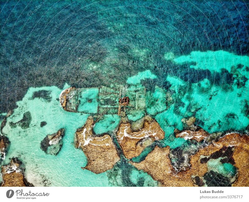 Drone photo of a shipwreck in the sea between rocks on Rottnest Island in Australia Wreck Ocean drone photo Aerial photograph Rock Coral reef Drone pictures