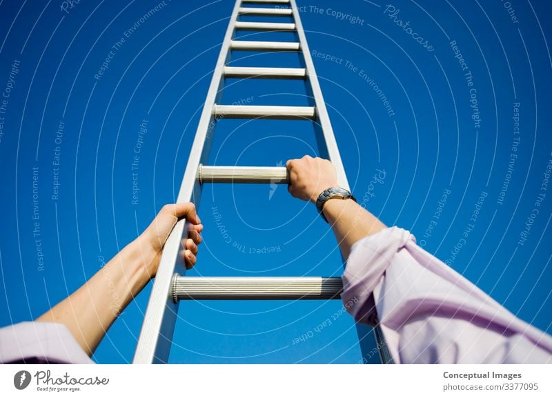 Businessman climbing a ladder Success Hope Idea Aspirations Balance High section Ladder Ladder of success Looking up Opportunity Motivation Moving up