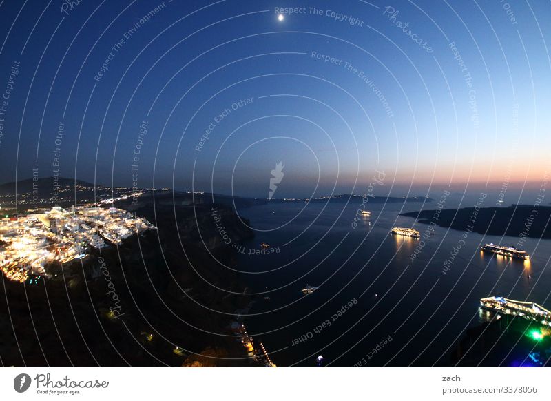 Night shot of Santorini with view over the caldera with cruise ships Cyclades Greece Caldera Ocean Island Mediterranean sea the Aegean Exterior shot