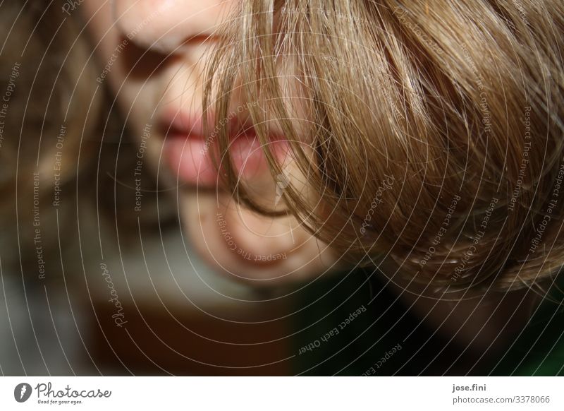 hair in front of a young girl's face, detail of nose, mouth, chin Girl Face partial portrait Flash photo Mouth Nose Chin Mole Hide Timidity wordless