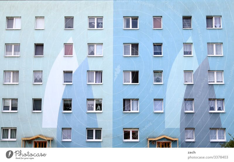 Facade of a high-rise building in blue Town Wall (barrier) Wall (building) door Architecture built Line House (Residential Structure) High-rise High-rise facade