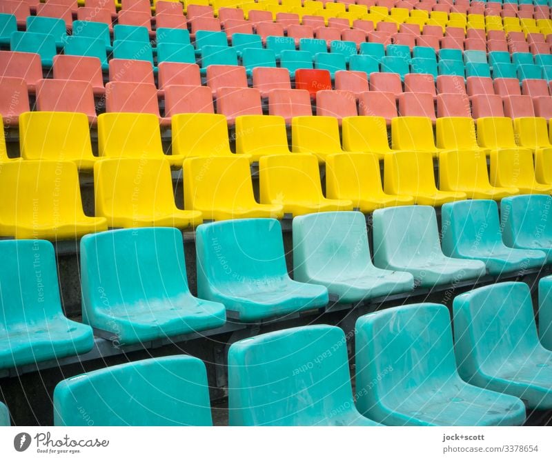 Rows of seats in different colours, but an exception proves the rule Seat series colourful Structures and shapes Design Long shot Contrast Multicoloured