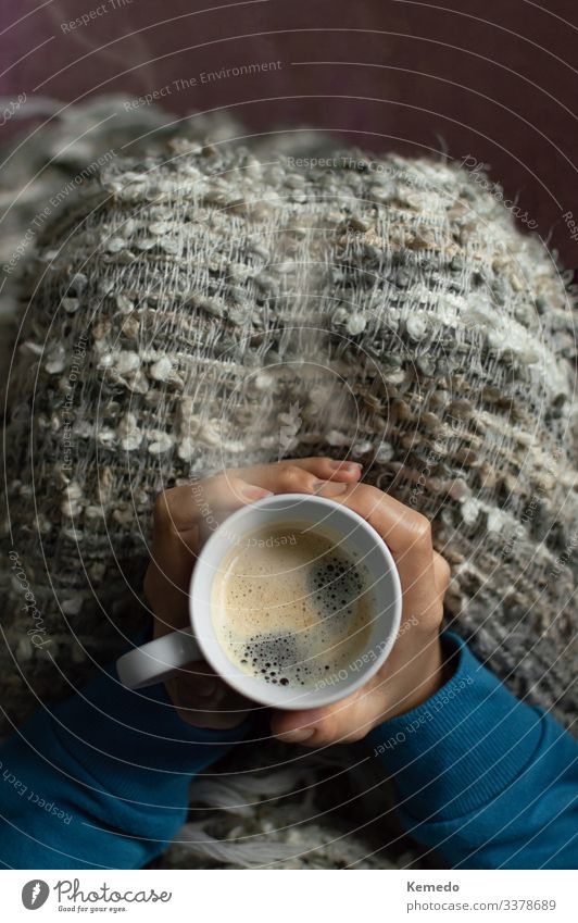 Woman covered with a blanket enjoy a hot drink on a cold day. Dairy Products Breakfast To have a coffee Slow food Beverage Hot drink Coffee Latte macchiato