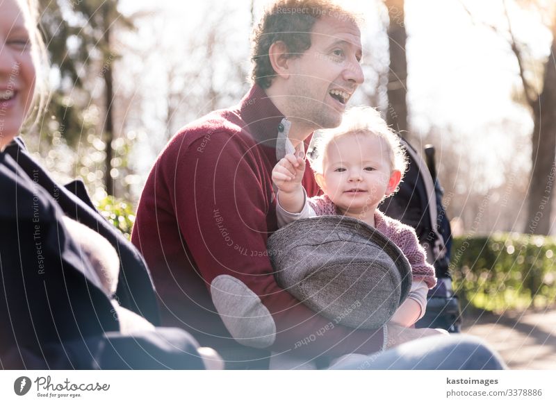 Young happy family with cheerful child having fun in park on sunny day. Lifestyle Joy Happy Beautiful Leisure and hobbies Playing Child Toddler Woman Adults Man