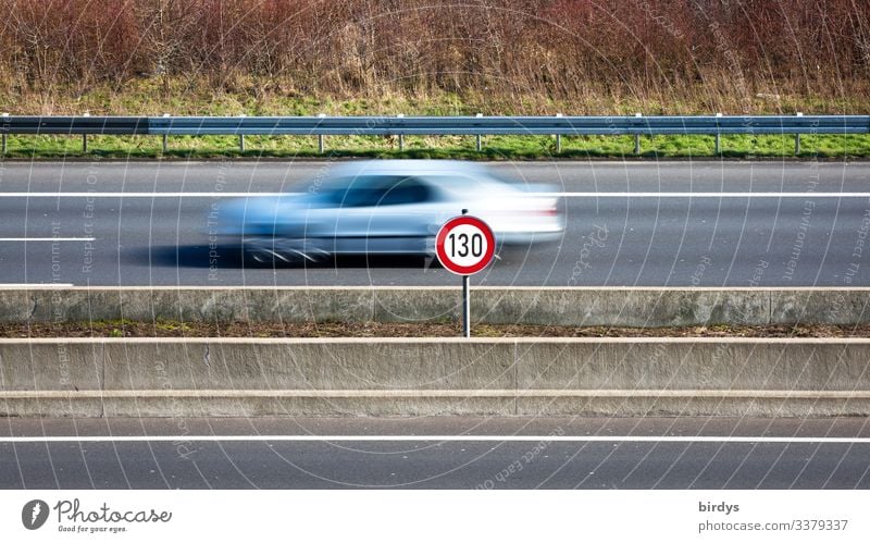 Speed limit 130, speed limit on German motorways. Sign at a motorway with passing car with motion blur. Climate change Transport Motoring Highway Road sign Car