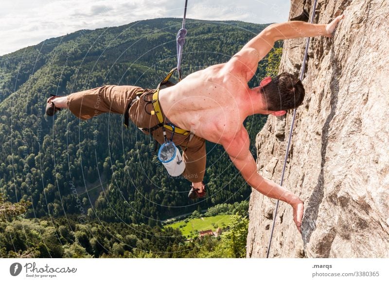 Acrobatics on rock Sports Climbing Free climber Sky Clouds Safety Trust peril Joy Man free torso Wall of rock Brave hang fun Steep Irritation Perspective