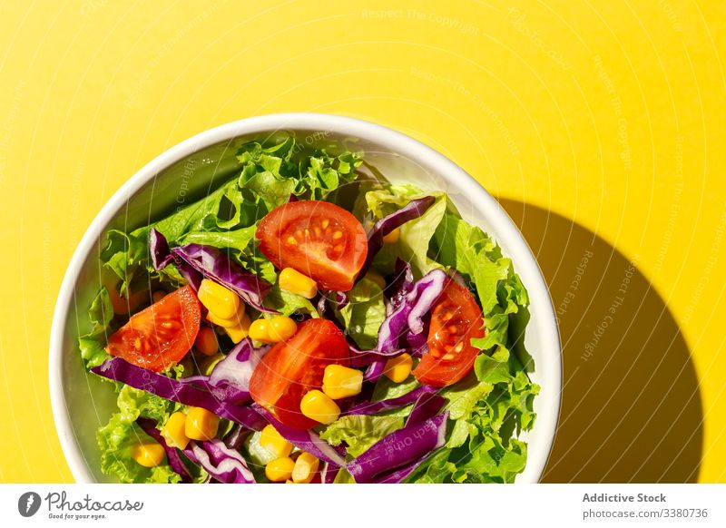 Fresh Green Salad With Yellow Salad Mixer Stock Photo, Picture and