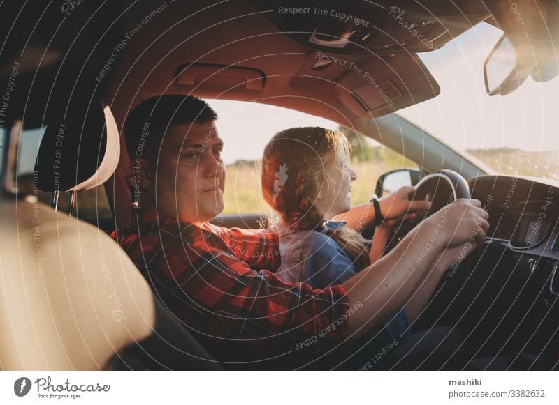 father teaching kid daughter to drive a car, family traveling on summer vacation child girl together happy trip vehicle parent journey lifestyle fun cheerful