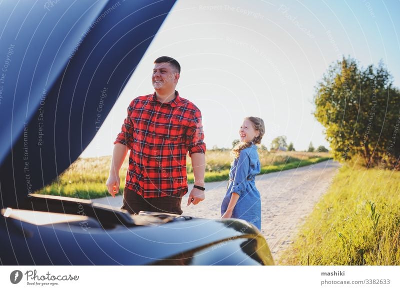 father and daughter fixing problems with car during summer road trip. Kid helping dad. child family girl mechanic repair automobile man outdoors vehicle parent