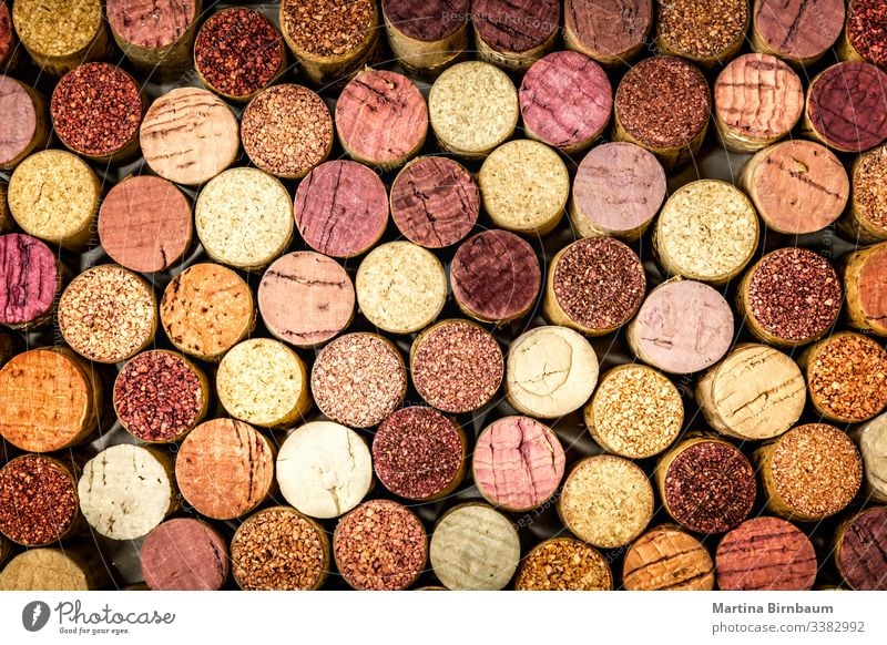 Full frame of wine corks stack vintage background closeup texture old alcohol winery red used full frame pattern wall circle purple wooden stopper many brown